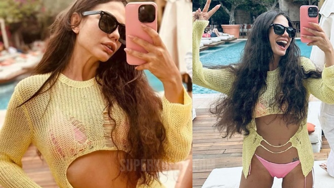 Demet Özdemir pembe bikinisiyle kamera karşısında